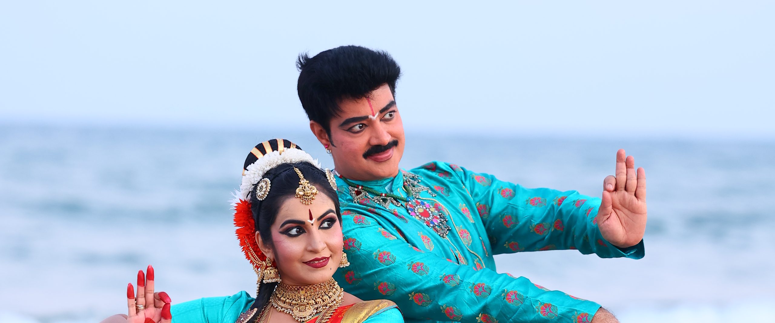 Guru Dr. Sanjay Shantaram and Smt. Pooja Raj dancing together at the shore